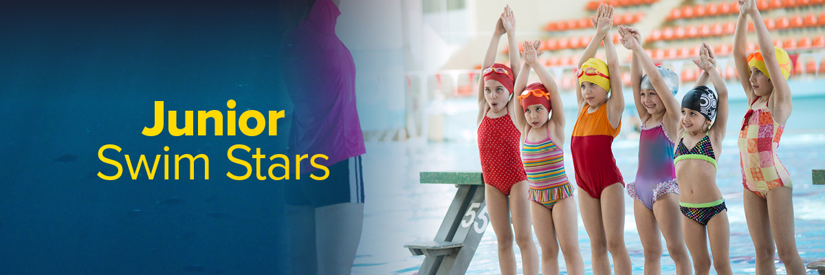 A group of children taking part in a swimming lesson